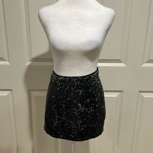 Forever 21 black sequin mini skirt with a zipper closure. Size medium. NWOT